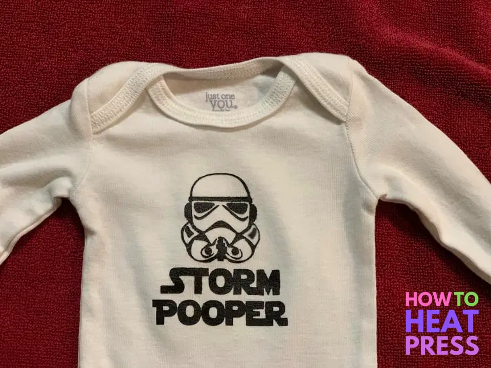 white baby onesie with black storm trooper design