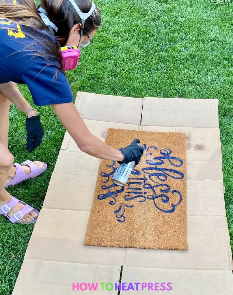 spraying flexseal on diy painted doormat