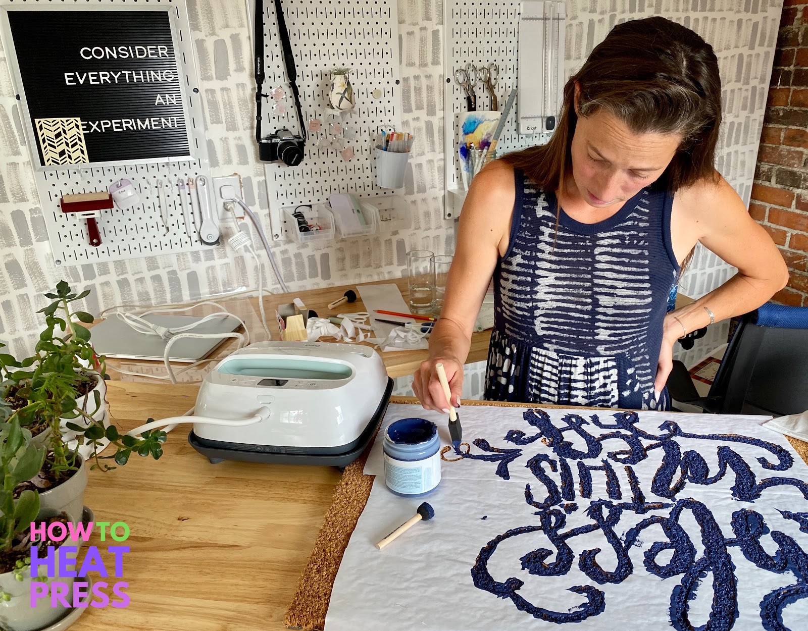 woman painting diy doormat in studio