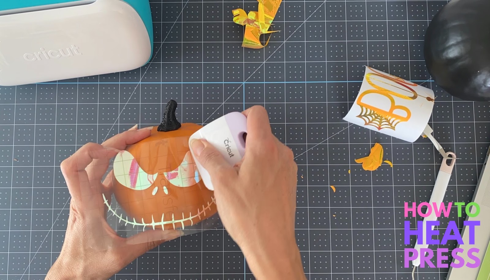 burnishing jack o lantern vinyl design on cricut pumpkin