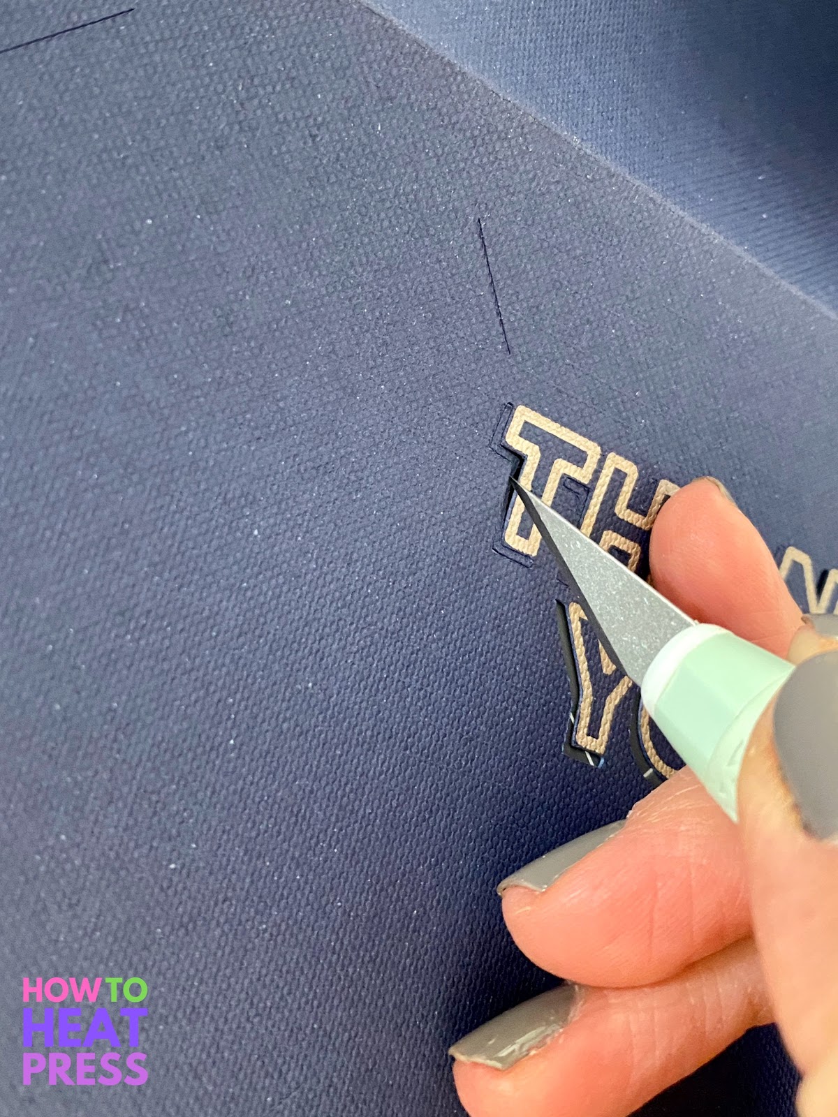 precision blade xacto knife removing cutouts on blue paper