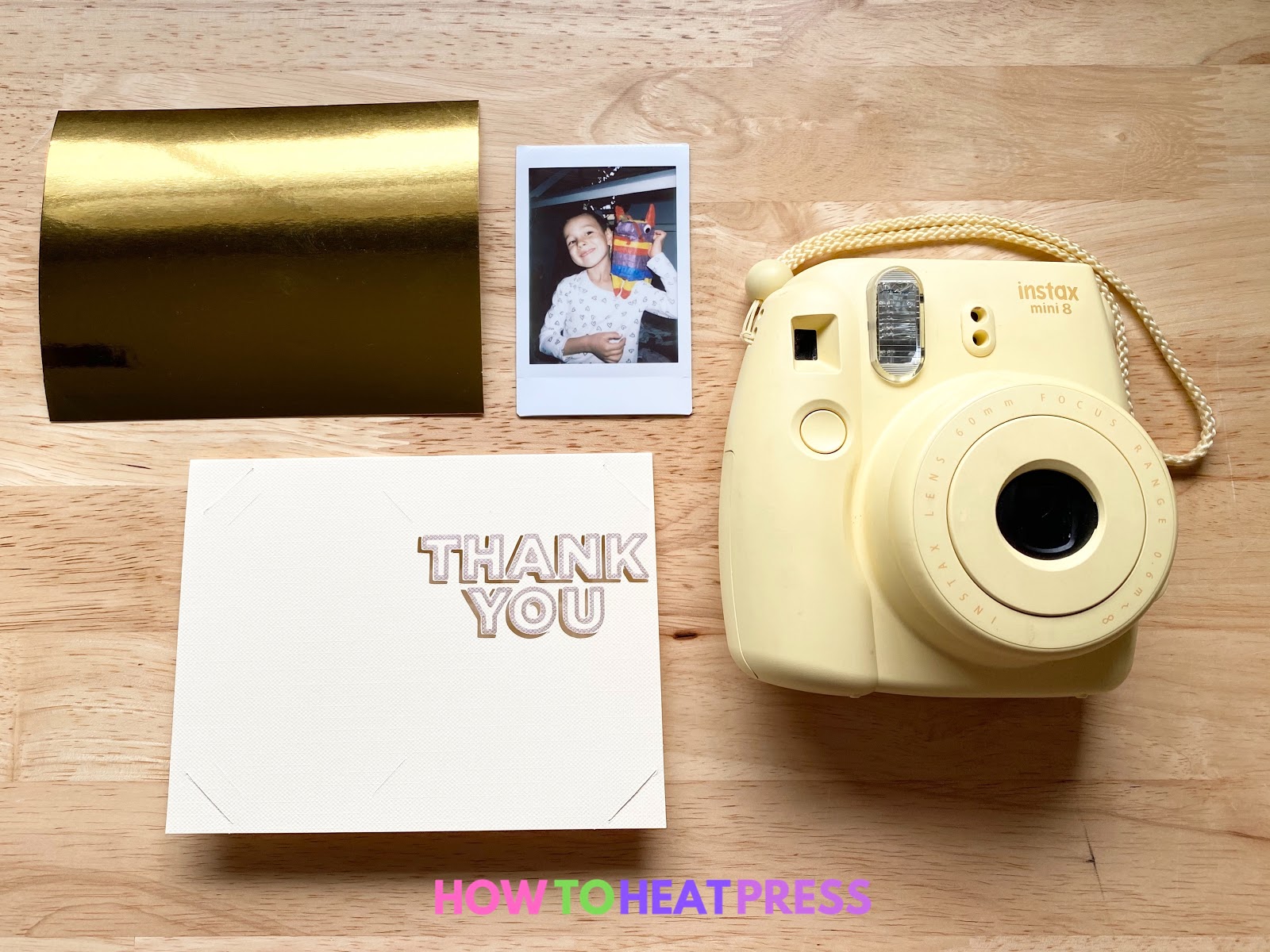 yellow fujifilm instax camera and photo with cream and gold diy thank you card