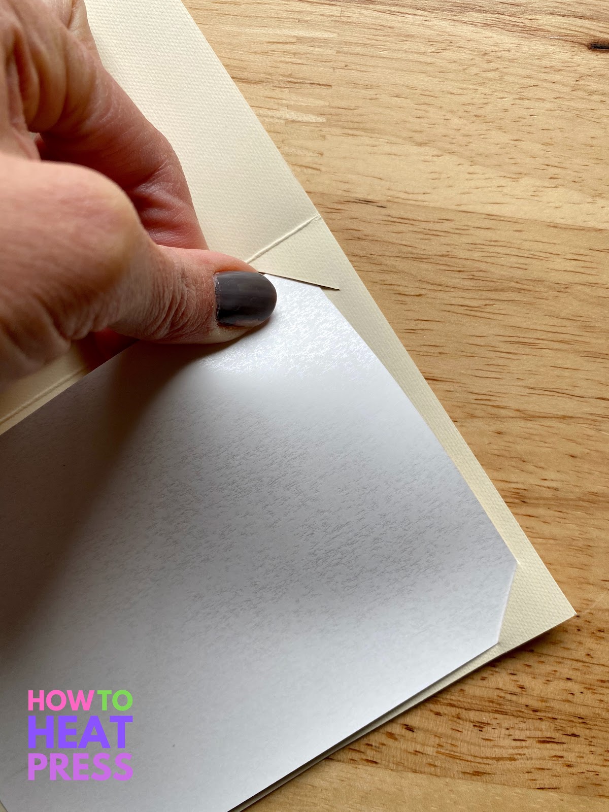 inserting cardstock into slits cut in beige blank insert card