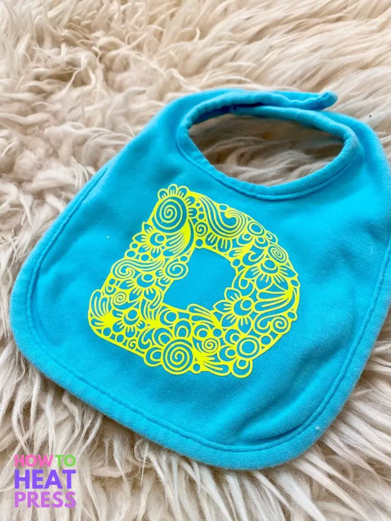 blue baby bib with neon yellow flower design