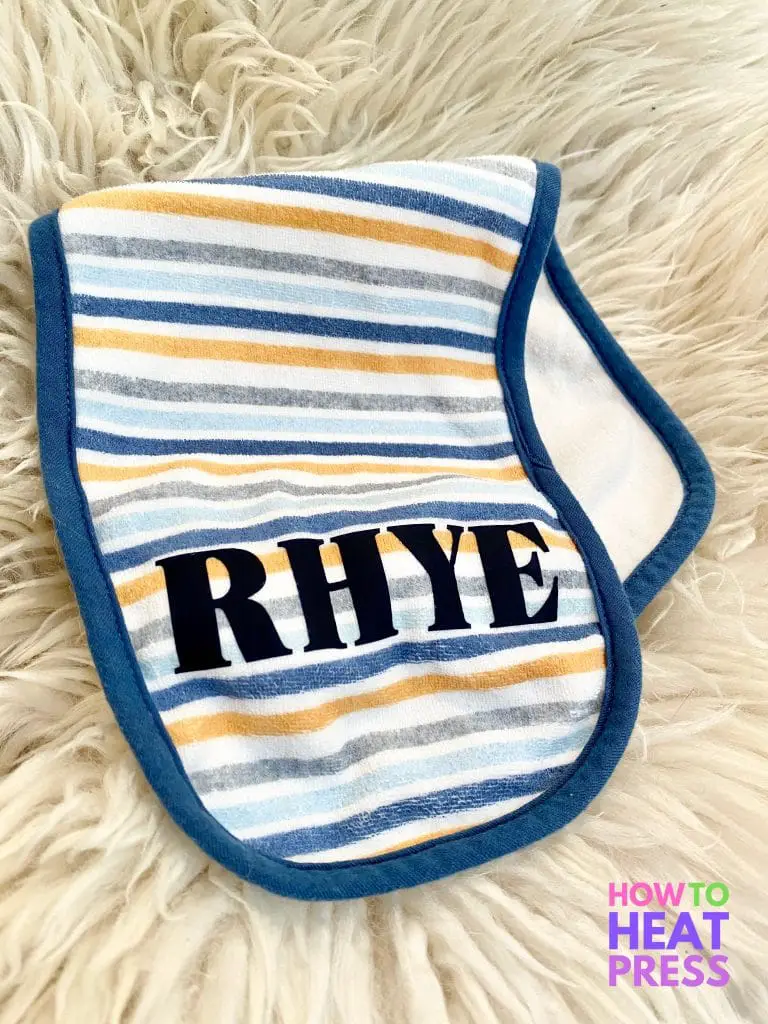 blue, white, and orange striped burp cloth with baby's name