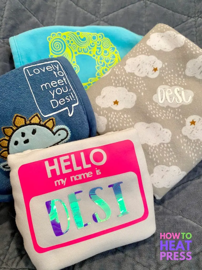 cricut baby onesie, bib, burp cloth, and baby blanket personalized with htv