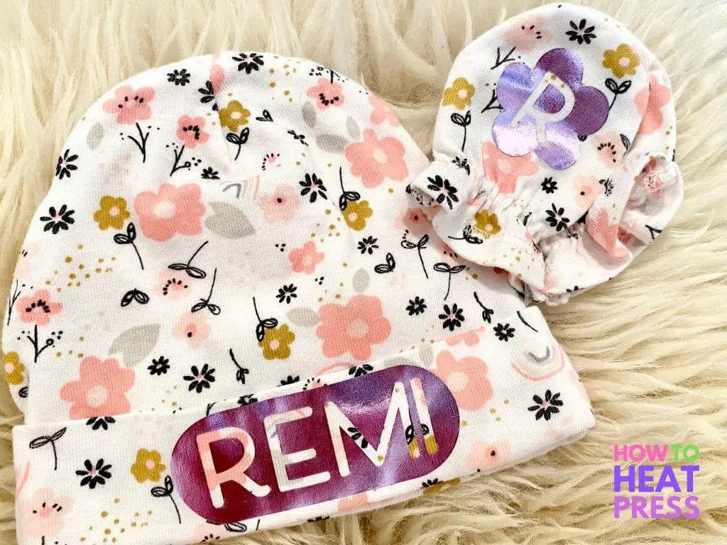 floral baby hat and mittens customized with purple metallic htv of baby name and initials