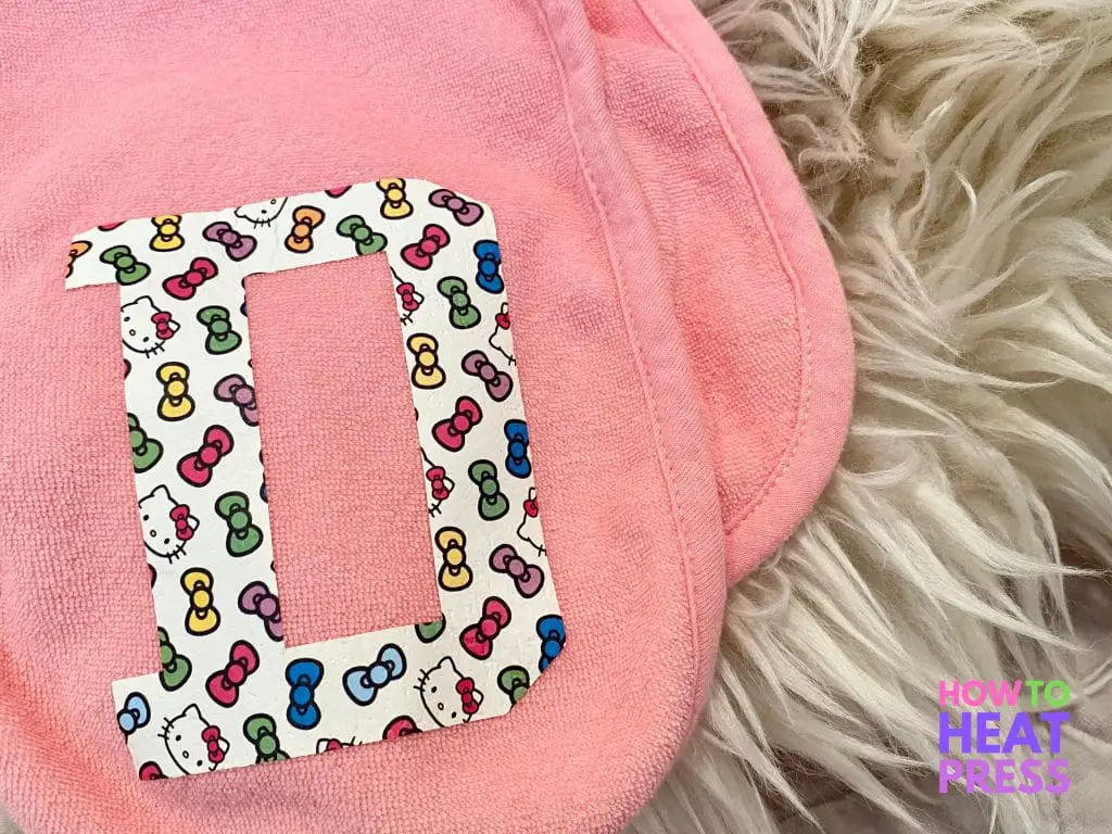 pink burp cloth with letter 'd' in hello kitty and bows htv