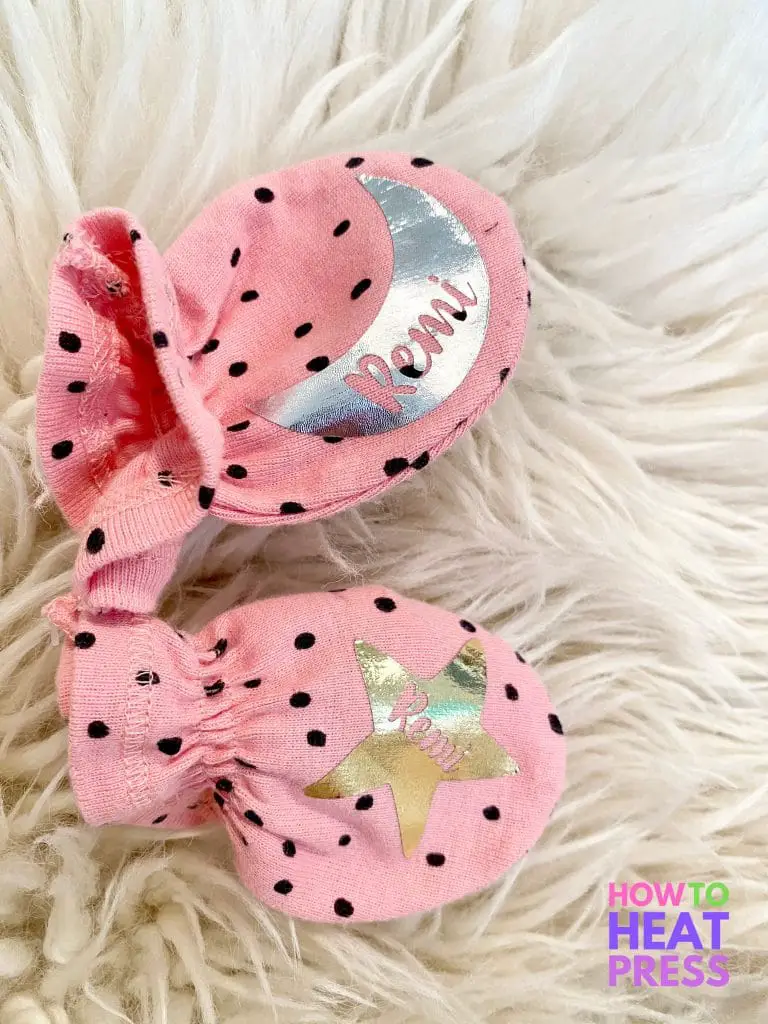 pink mittens with black polka dots and baby's name in moon and star metallic htv