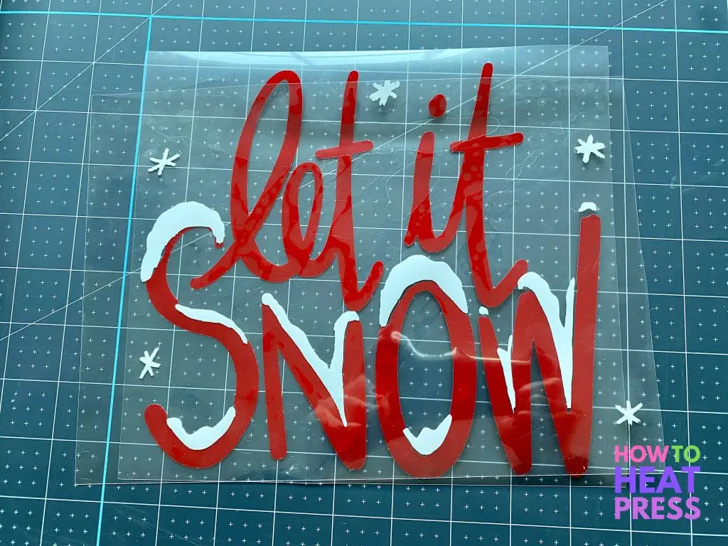 red and white 'let it snow' design for HTV on wood project