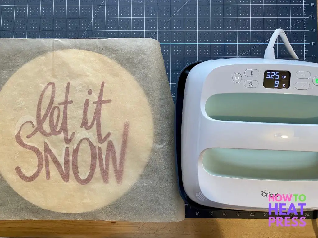 parchment paper protecting wood disc and htv from heat press